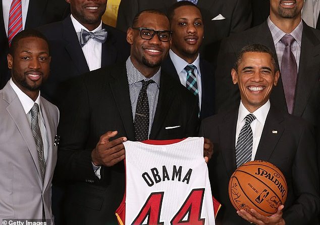 Obama and LeBron JAmes are seen together in 2013. The former president reportedly urged NBA players to resume the postseason following a boycott to protest racial injustice