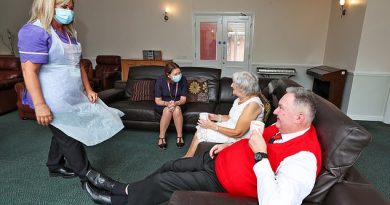 Jane Ward (left) and Rachael Peacock (sitting) talks to Alan Venn and Joan Woods, residents of Ashwood Court residential care home in Lowton, Warrington, on July 20