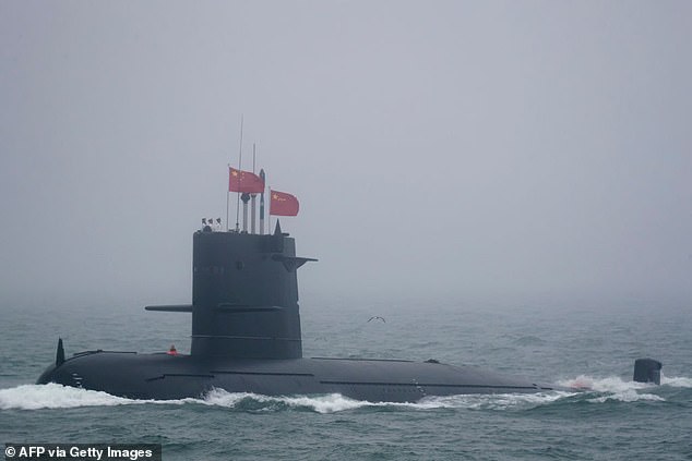 China is conducting a series of military drills in four sea regions at roughly the same time, an unusual move that could be sending political signals, reports say. This file picture taken on April 23, 2019 shows a Great Wall 236 submarine of the People