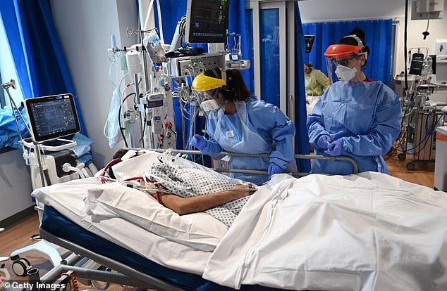 Clinical staff wear Personal Protective Equipment (PPE) at the Intensive Care unit at Royal Papworth Hospital on May 5