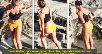 Emma Watson opts for a cropped black bikini top and mismatched neon bottoms as she relaxes on the beach in Italy