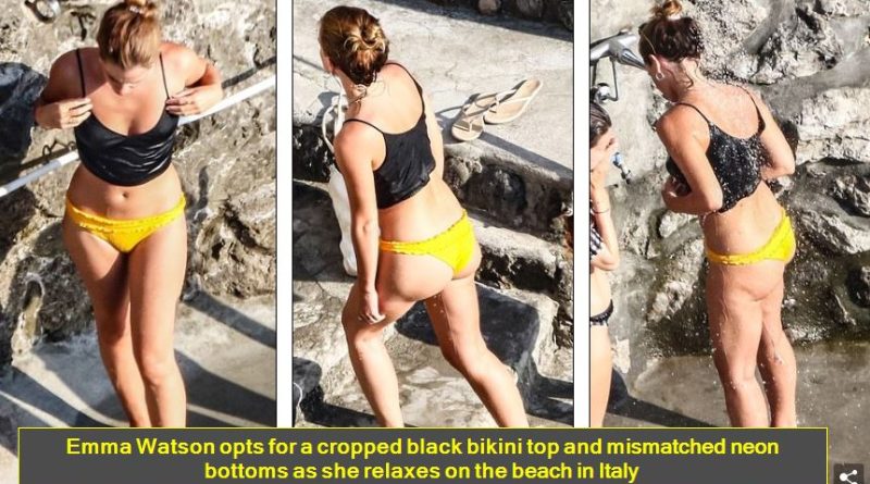 Emma Watson opts for a cropped black bikini top and mismatched neon bottoms as she relaxes on the beach in Italy