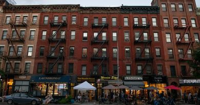 New York City residents are fleeing to the suburbs as the COVID-19 pandemic and an uptick in crime has forced those with cash to seek larger living spaces while being able to work from home. The image above shows a row of apartment buildings and restaurants in the Hell