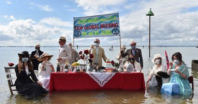 Extinction Rebellion protesters today staged a Titanic-themed dinner party in the sea to shine a light on rising sea levels