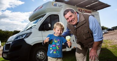 Ice cream maker David Baker (pictured with his grandson Arlo) said he disliked seeing fumes billowing from his stationary vans because the engine had to be on for the machinery to work