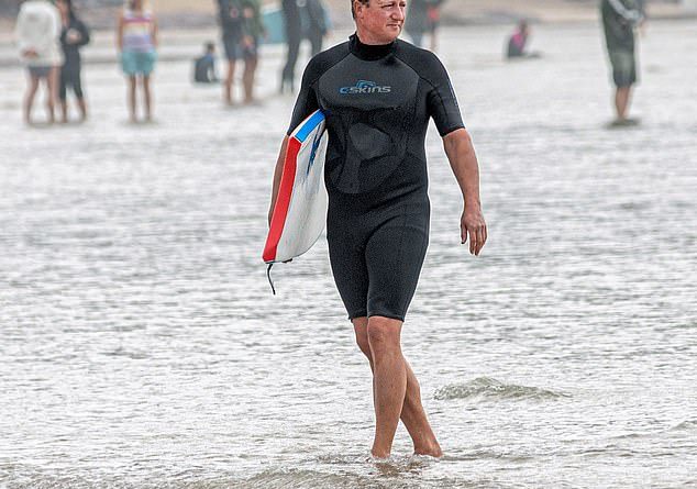 David Cameron joined the hoards of tourists on Polzeath Beach in Cornwall on Thursday