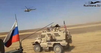 High-speed confrontation: This is the moment before the Russian vehicle from which the video footage came hits the U.S. armored vehicle as the two patrols move fast across a field in northern Syria with a Russian military helicopter flying low overhead