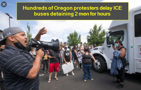 Hundreds of Oregon protesters delay ICE buses detaining 2 men for hours