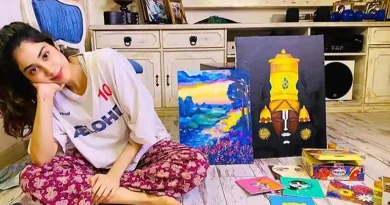 Janhvi Kapoor poses with her paintings.