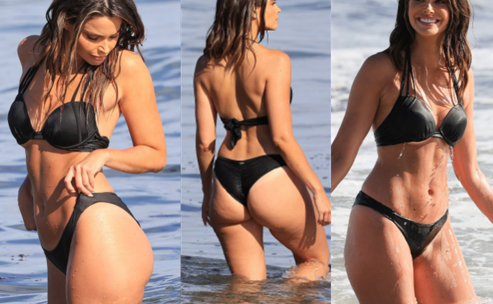 Jennifer Lahmers SEXY TV host sets pulses racing as she flaunts her incredible figure in a black bikini while splashing around in the ocean