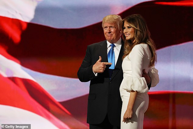Then presumptive Republican presidential nominee Donald Trump gestures to his wife Melania after she delivered a speech on the first day of the Republican National Convention on July 18, 2016 at the Quicken Loans Arena in Cleveland, Ohio