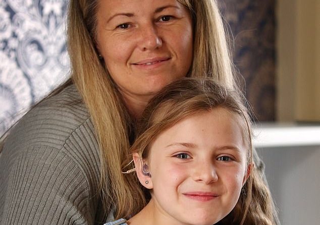 Julie Muller, 41, and her daughter Sadie-Grace, eight, pictured, were stopped by a worker at the entrance of a Cotswold Outdoor shop in Newcastle who asked where her masks was