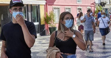 On Friday, Portugal reported its highest new daily virus figure for seven weeks, with 401 cases detected (tourists wearing masks in a busy tourist street, pictured)