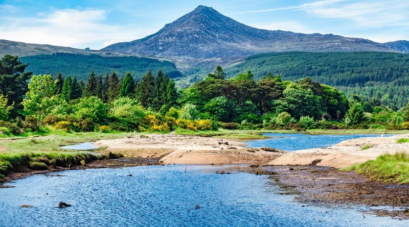 The Isle of Arran is known as ¿Scotland in miniature¿ - a leisurely drive around the island takes two hours. Pictured is Brodick Bay looking across to Goat Fell