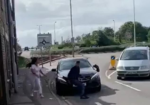 Video shows the terrifying moment a motorist runs over a man and sends him flying into the air during a bizarre dispute in Peterborough which unfolded in front of shocked bystanders