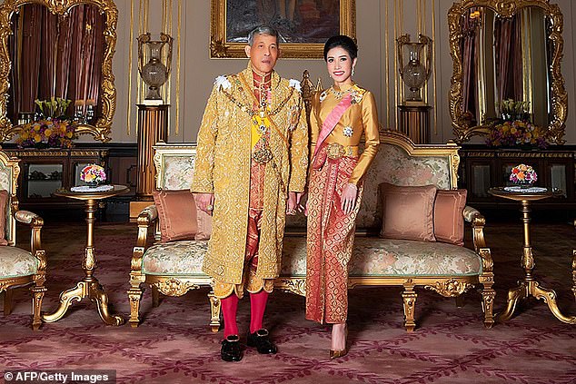 King and consort: Thai monarch Maha Vajiralongkorn appointed former royal bodyguard Sineenat Wongvajirapakdi as his consort last year (pictured together in August 2019) - but she soon fell from grace and was stripped of her titles