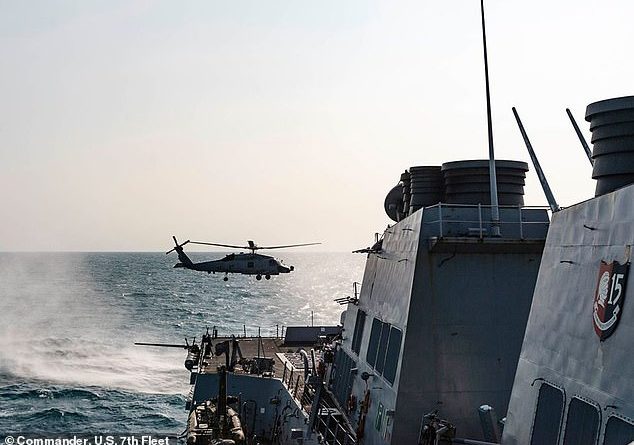 A U.S. Navy warship has transited the narrow and sensitive Taiwan Strait for the second time in two weeks. Above, a file image of a MH-60 Sea Hawk transiting the Taiwan Strait in May this year