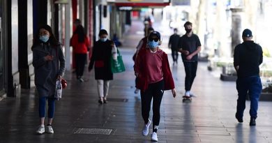 Victoria has reported another 94 coronavirus cases and 18 deaths, the first time the infection numbers have been below 100 in months (pictured, residents wearing face masks walking near-empty streets in Melbourne)