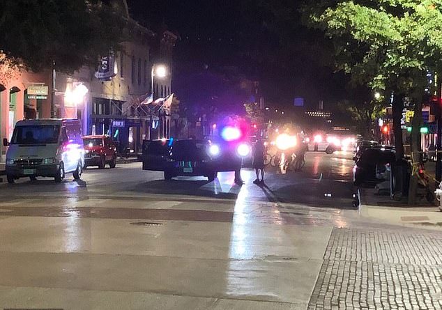 A homeless woman was shot killed after being struck by a stray bullet during a massive brawl in Austin overnight.