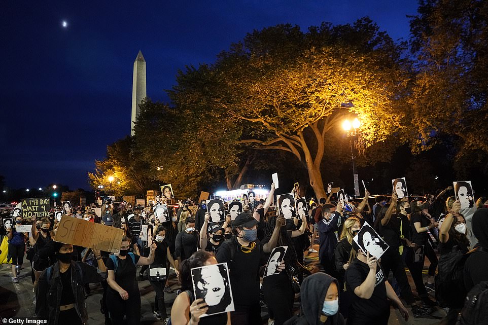 WASHINGTON DC: Demonstrators march near the White House on Wednesday night