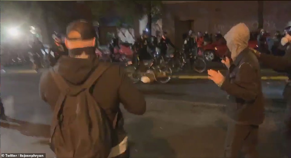 Cellphone footage captured the moment a cop in Seattle pushes his bike over the head of a protester during demonstrations in the city