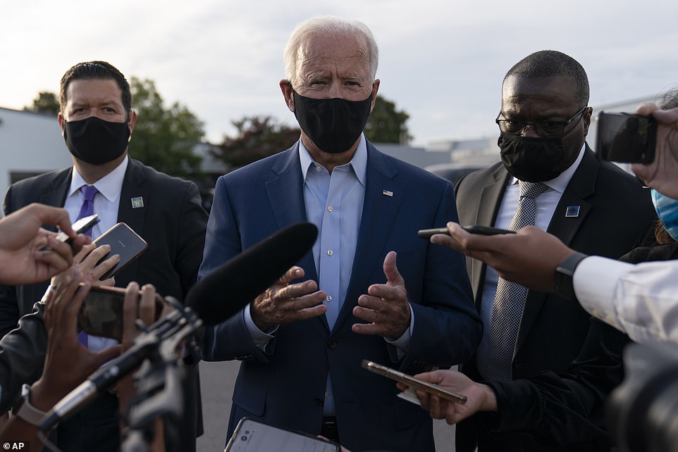 Joe Biden made vague remarks when asked about the grand jury decision on a tarmac in Charlotte, North Carolina, on Wednesday evening (pictured)