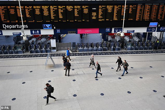 A small number of commuters at Waterloo Station, in London in the middle of what should be rush hour on Thursday, after the PMannounced a range of new restrictions to combat the rise in coronavirus cases in England