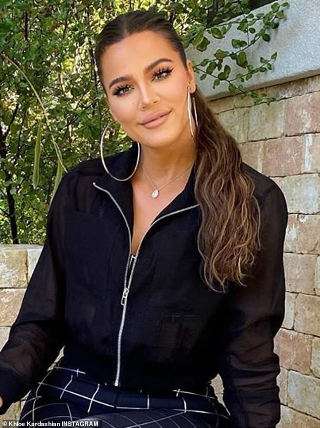 Something has changed? In the new image shared on Thursday, Khloe has her brunette hair pulled back with a wavy ponytail down her back and beige makeup perfectly blended to look dewy