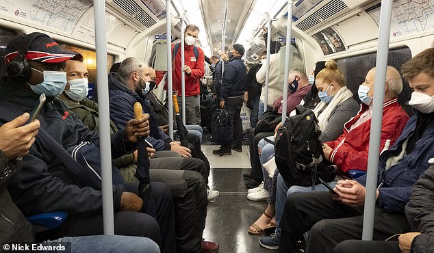 Passengers on the Jubilee Line on London's underground on Thursday morning. The Prime Minister Boris Johnson addressed the nation this week regarding new coronavirus restrictions