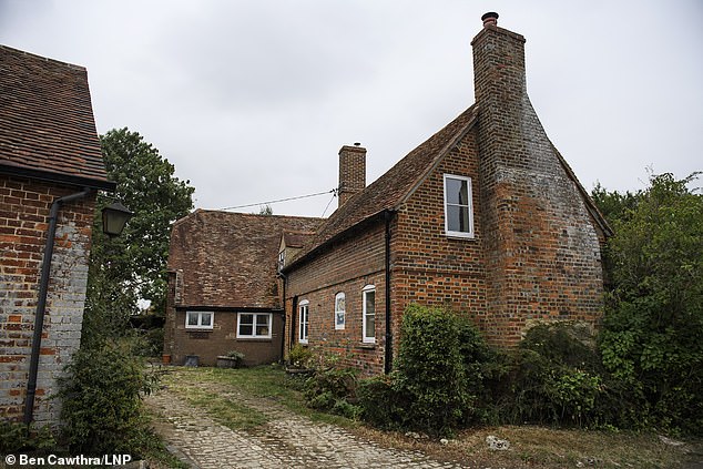 Land Registry records also show that there have been some changes to the status of the couple's country home, a £1.25 million farmhouse in Thame, Oxfordshire (pictured), which has a tennis court and swimming pool