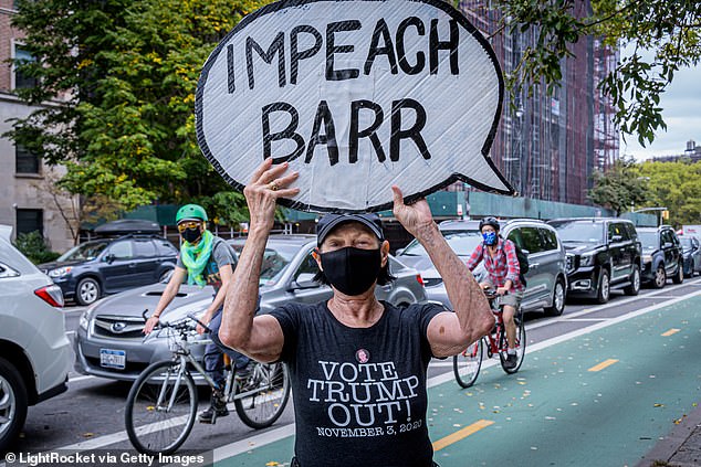 A critic of the Attorney General is pictured in New York City on Saturday