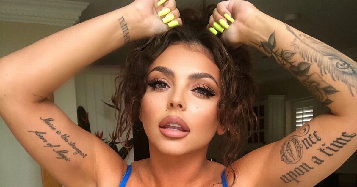 Little Mix’s Jesy Nelson unveils her many tattoos as she poses up in blue bra