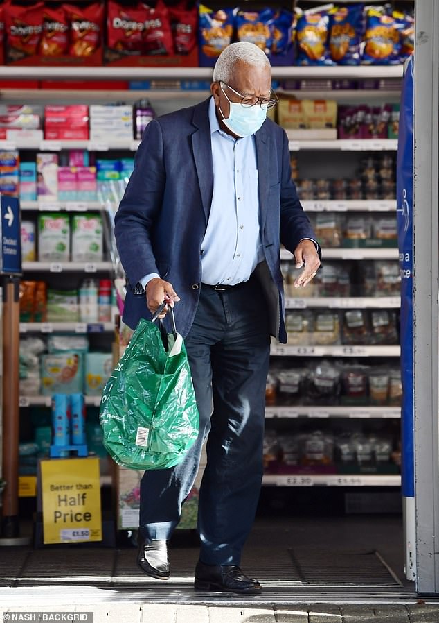 The legendary newsreader was seen buying a newspaper from a local Tesco store in London