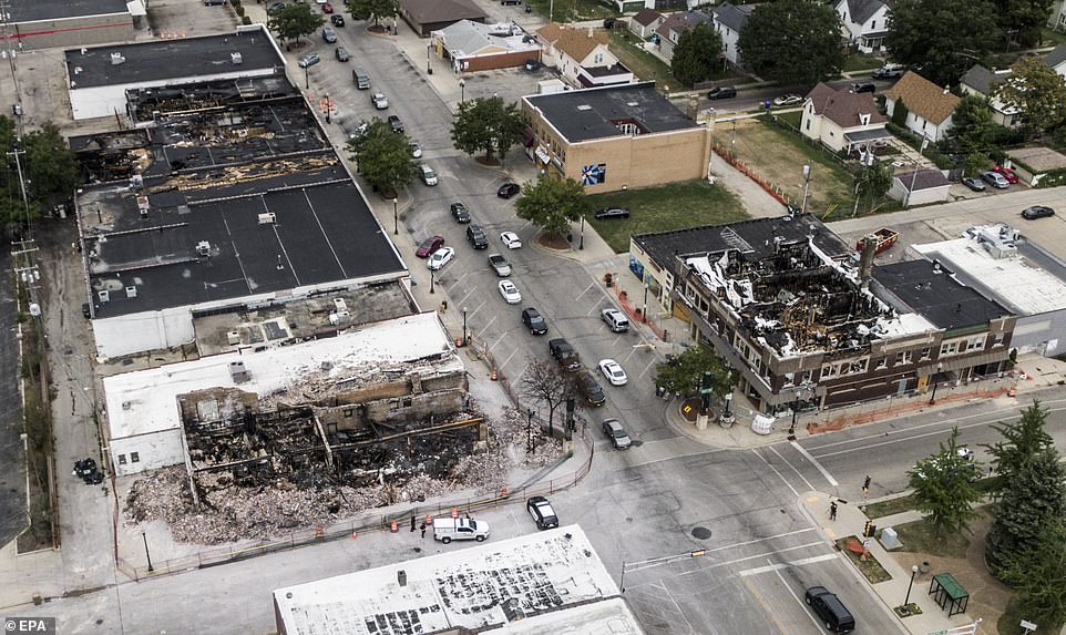 Buildings that were gutted by fires during three nights of rioting in the city of Kenosha, Wisconsin, are seen from the air ahead of a visit by Donald Trump which is due to take place today
