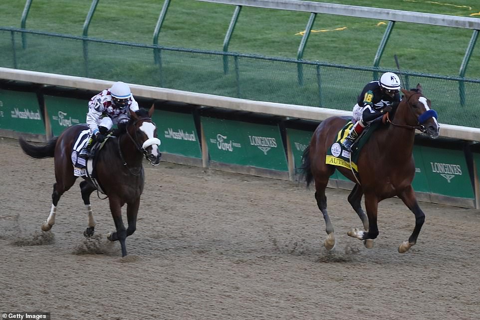 Authentic (right) ridden by jockey John Velazquez runs down the stretch to win the 146th running of the Kentucky Derby at Churchill Downs, defeating a late charge from favorite Tiz the Law (left)