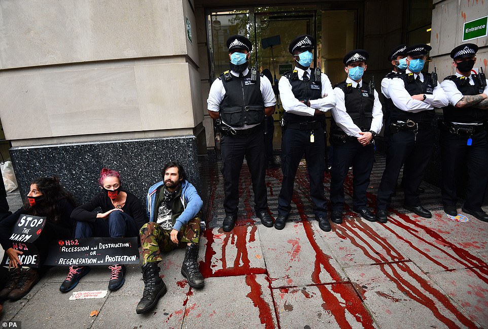 Extinction Rebellion activists glue themselves to London ...