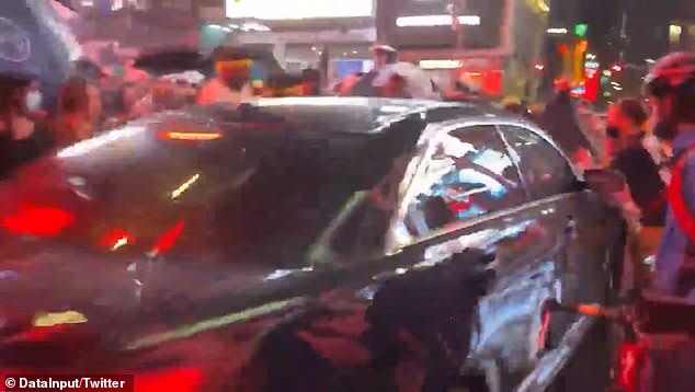 Cell phone footage taken Thursday night shows a group of Black Lives Matter protesters standing in front of a black vehicle
