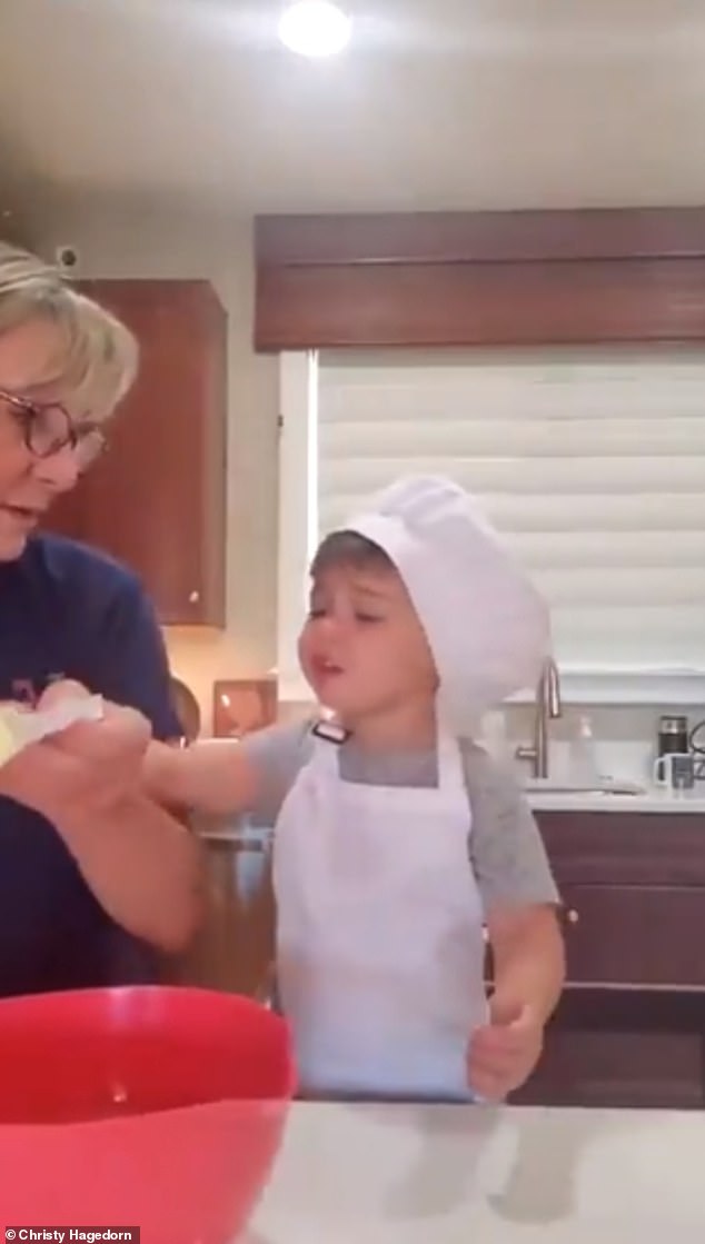 Christy, from Indiana, shared the clip of her 24-month-old son Cade cooking with his
