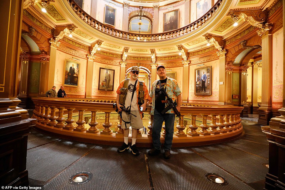 Demonstrators carrying rifles entered the statehouse in Michigan Thursday during a rally to protect the Second Amendment
