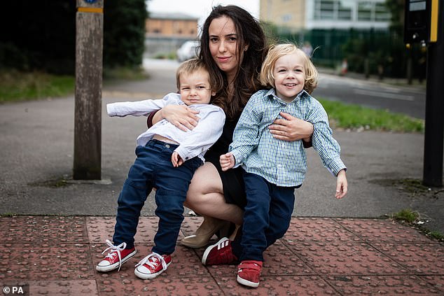 Stella Morris (centre) and sons, Gabriel (right) and Max (left) leave Belmarsh Prison after visiting her partner and their father, Julian Assange