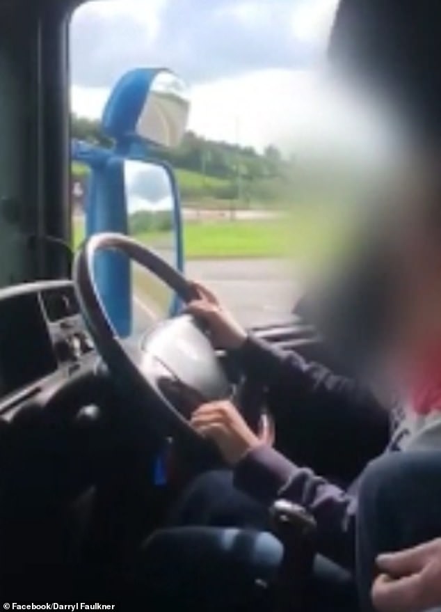 The young girl was filmed steering the huge truck along the M1 near Dungannon, Northern Ireland