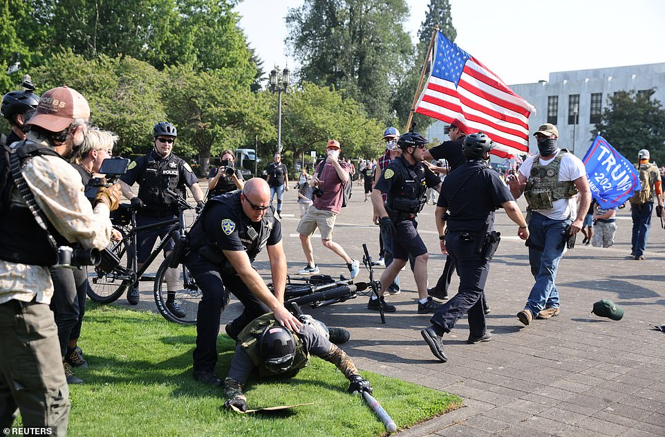 Heavily-armed and masked Trump supporters clashed with counter-protesters and police in Salem, Oregon on Monday