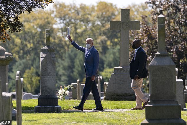 Joe Biden waves to reporters as he leaves church in Wilmington, Delaware on Sunday. New polling shows that nearly a majority ofAmericans believe that Biden wants to calm down the Black Lives Matter protests as opposed to throwing more gas on the fire
