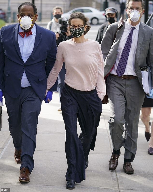 Bronfman arrived at court wearing a mask on Wednesday ahead of her sentencing hearing. Her lawyers want a judge to give her three years' probation instead of prison time but prosecutors argue she deserves five years behind bars