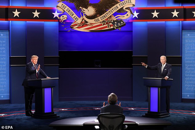 Trump (L) and Democratic presidential candidate Joe Biden (R) spar while moderator Chris Wallace (C) attempts to gain control during the first 2020 presidential election debate at Samson Pavilion in Cleveland, Ohio