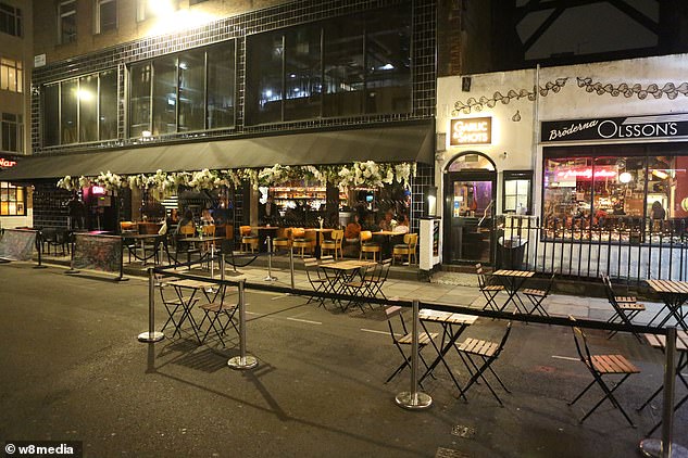 Tables in Soho, west London, were empty as restaurants and bars closed at 10pm