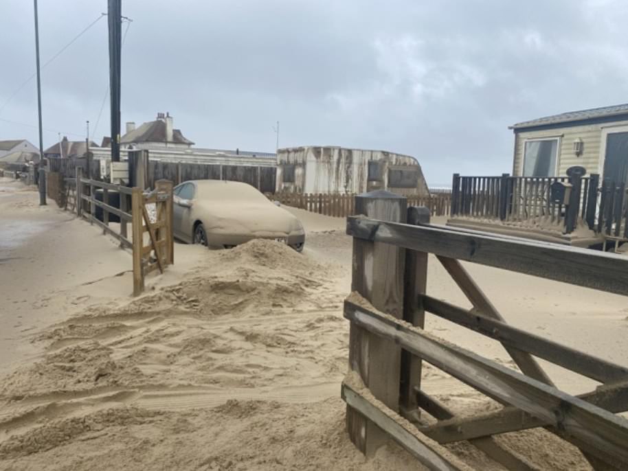 Winds gusting at up to 70mph carried particles from the beach of Walcott in Norfolk on Saturday