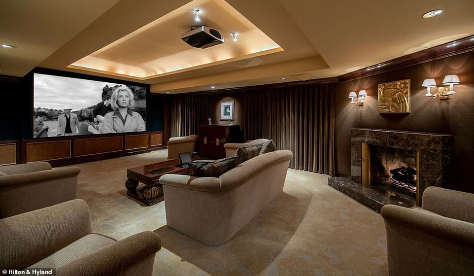 Screening room: The home also includes a full theatrical screening room, fitting since James has a deal with Warner Bros. for several projects, that even comes equipped with one of seven fireplaces in the home