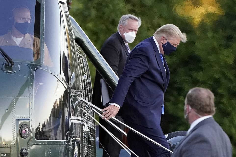 Meadows (center) previously told reporters that Trump' 'vitals over the last 24 hours were very concerning and the next 48 hours will be critical in terms of his care. We are still not on a clear path to a full recovery'