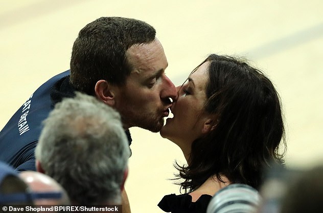 Sir Bradley celebrates winning gold and breaking the world record in the Men's Team Pursuit Final by kissing his wife Cath during day seven of the Rio Olympics 2016